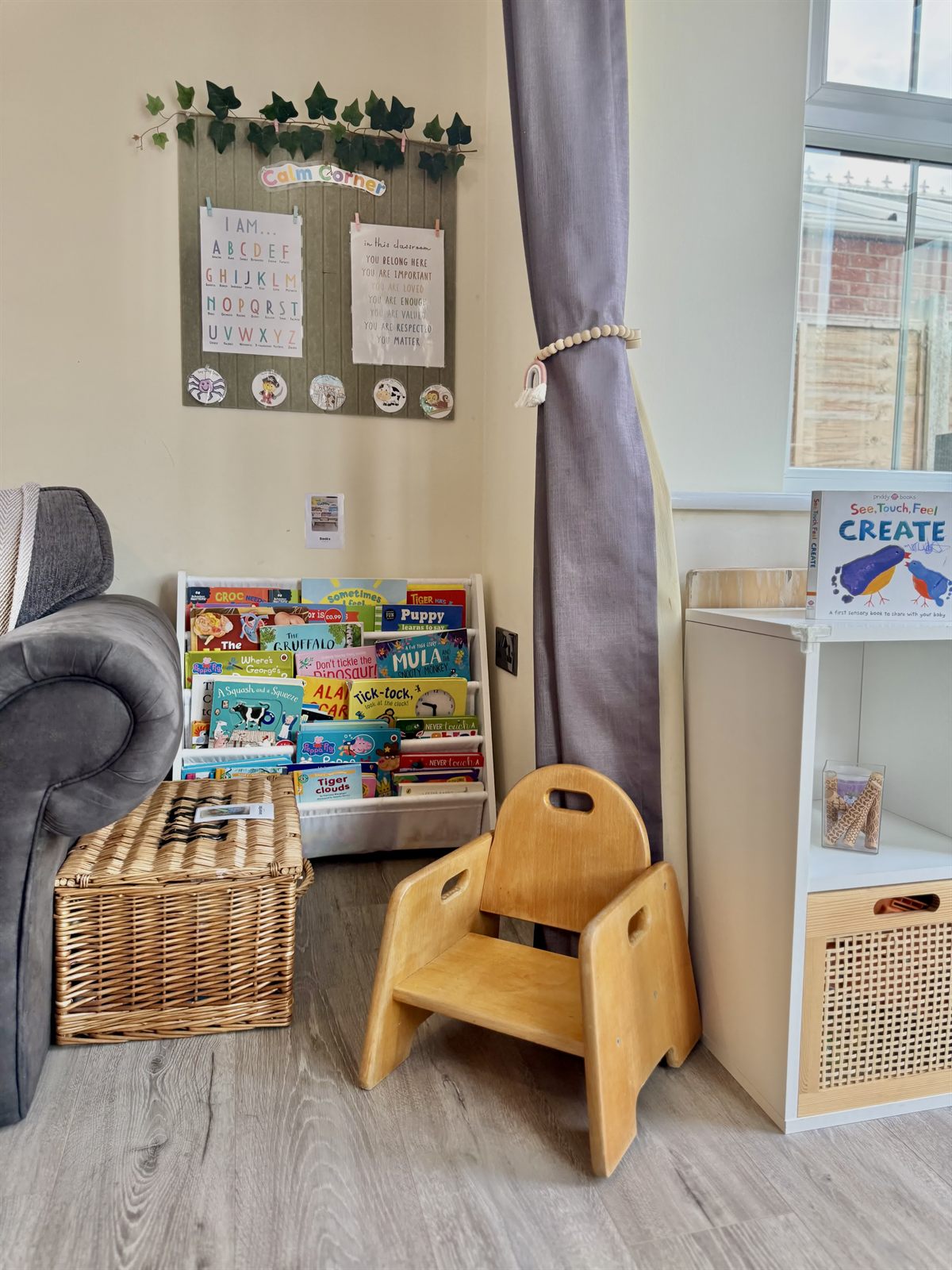 The book corner with a childs armchair and picture books